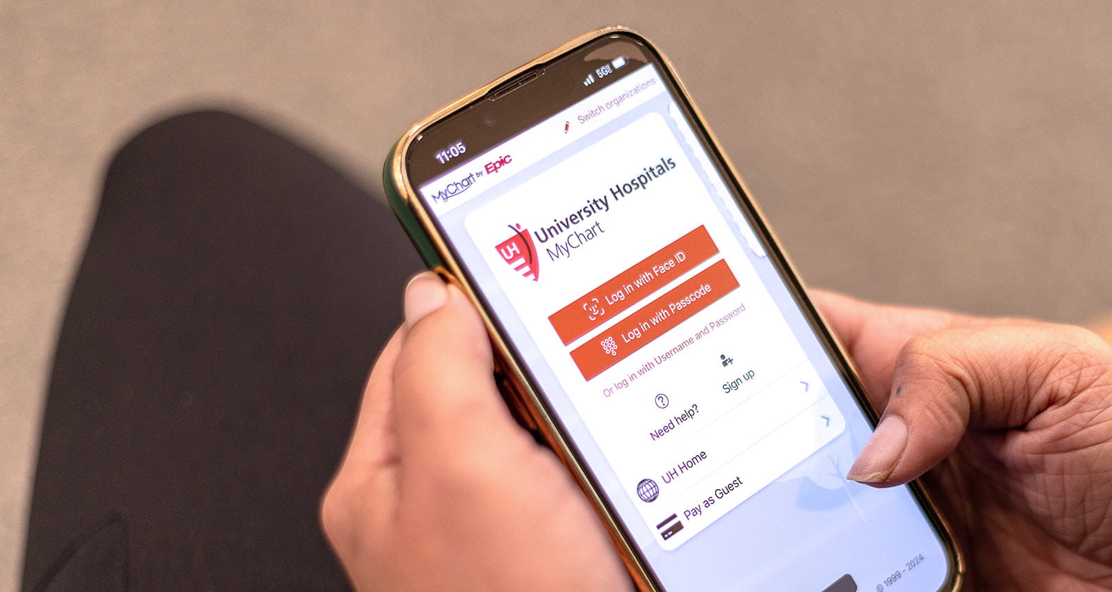 A man views UH MyChart on his mobile phone