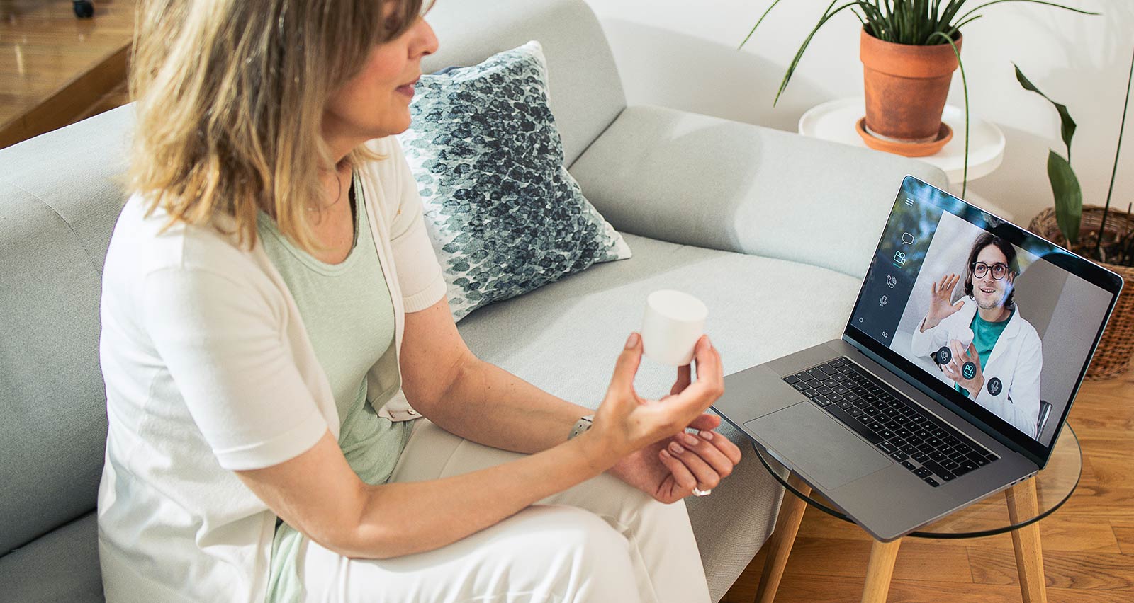 A woman is consulting online with a doctor