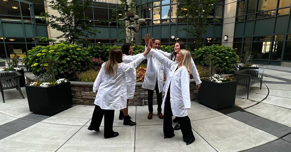 dietetic interns high-fiving