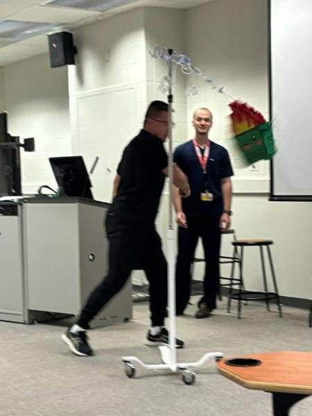 residents hitting a pinata