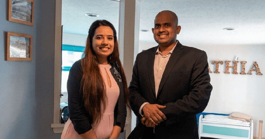 geriatric medicine fellow graduates in front of window