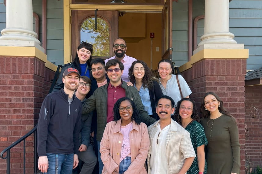 group of infectious disease fellows posing for a picture on steps