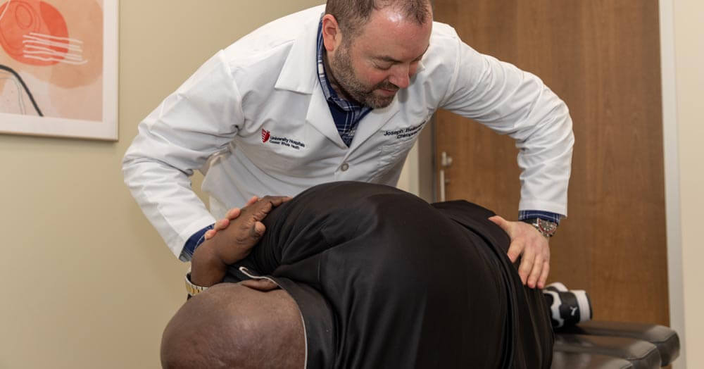 chiropractic doctor working on a patient's back