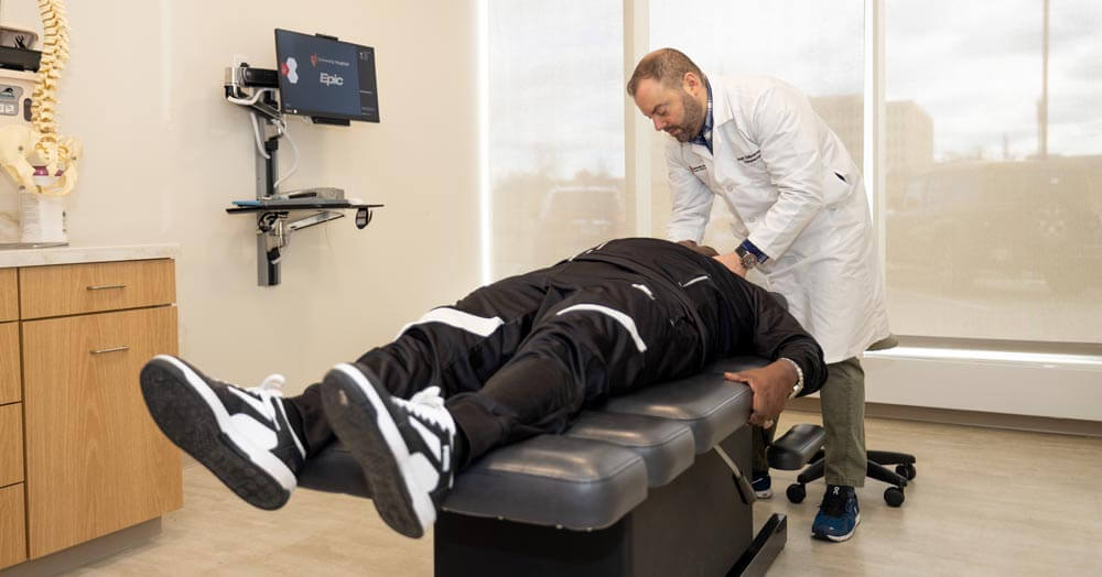 patient on a table being treated by a chiropractic doctor