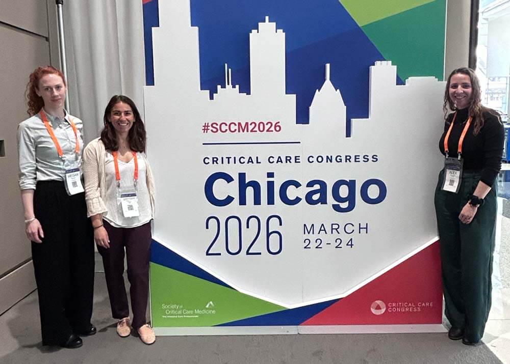 fellows standing in front of SCCM2026 conference sign