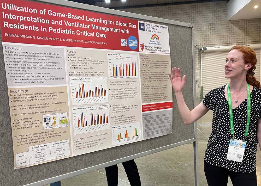 female fellow presenting research poster
