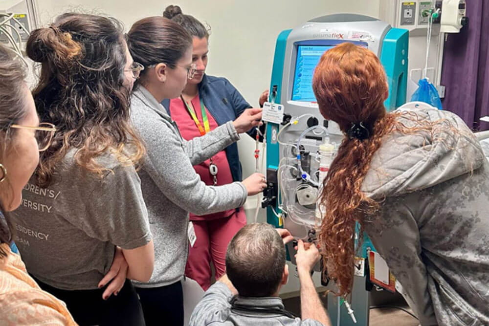 peds critical care fellows at simulation machine