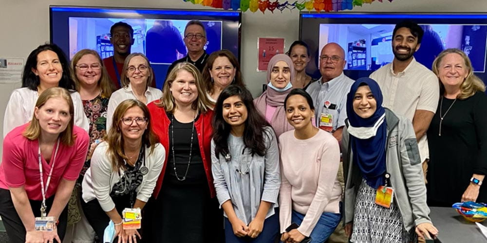 fellows displaying their diplomas