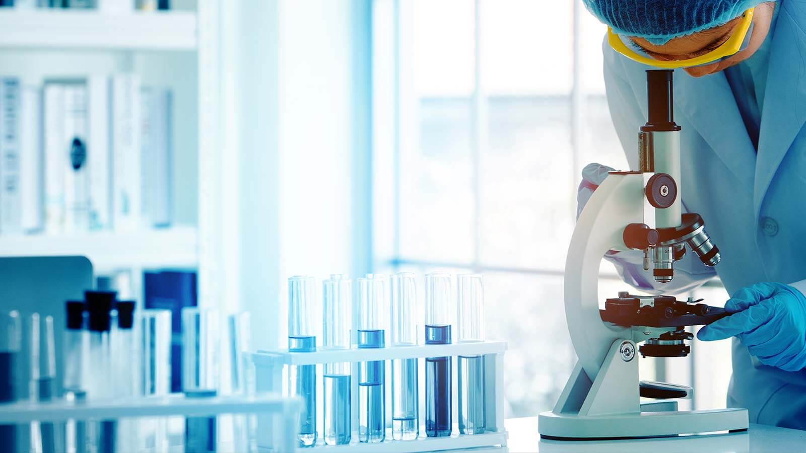 scientist with microscope