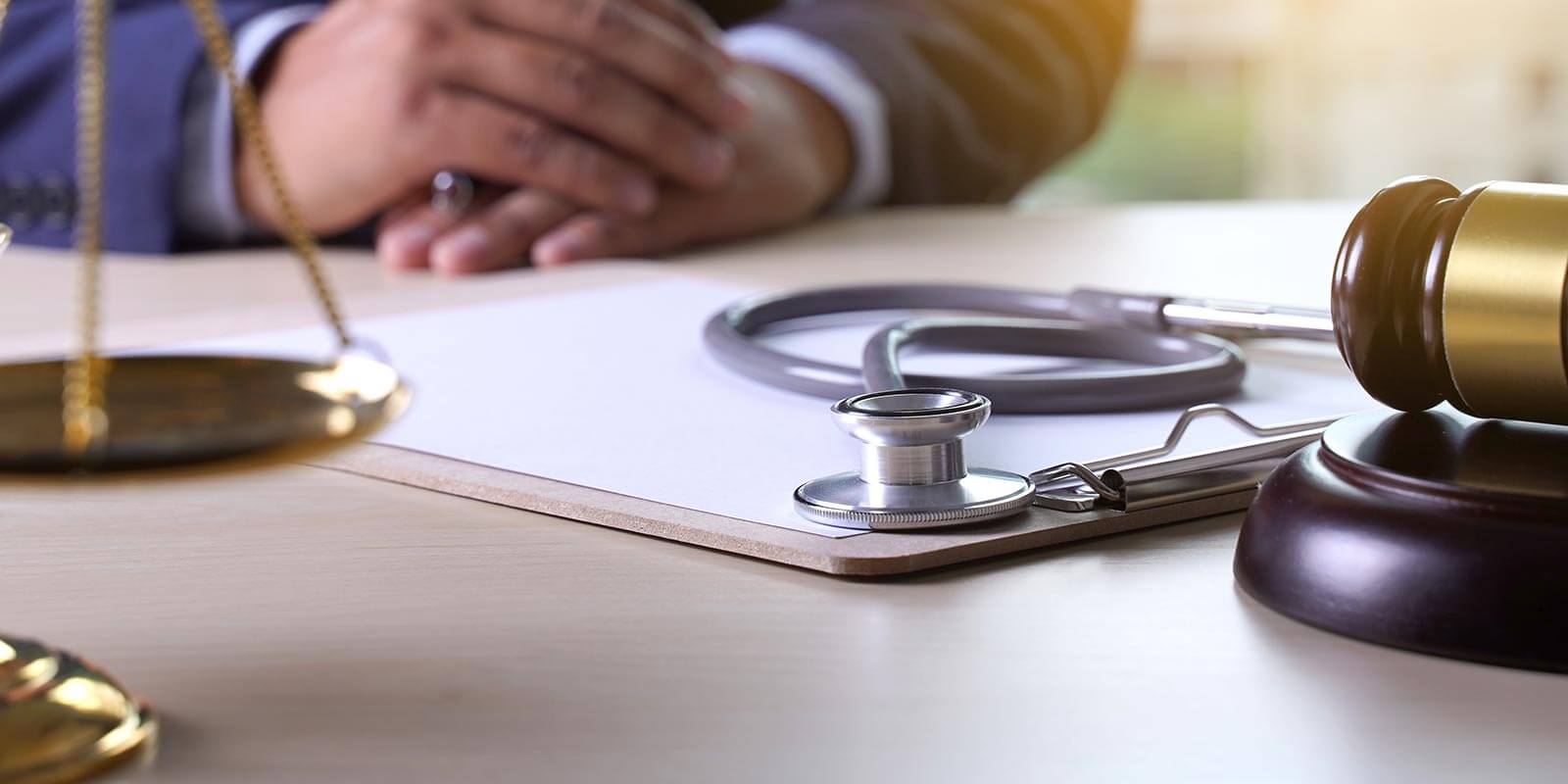 Law gavel stethoscope Health care business rules