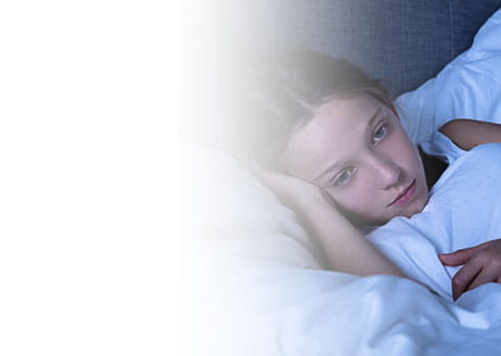 Girl Awake Lying On Bed