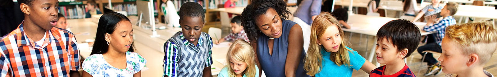 Adult and a group of children at the resource center