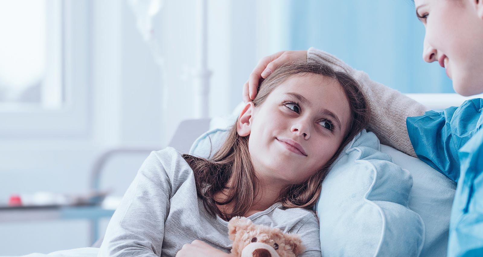 Smiling caregiver visiting sick child