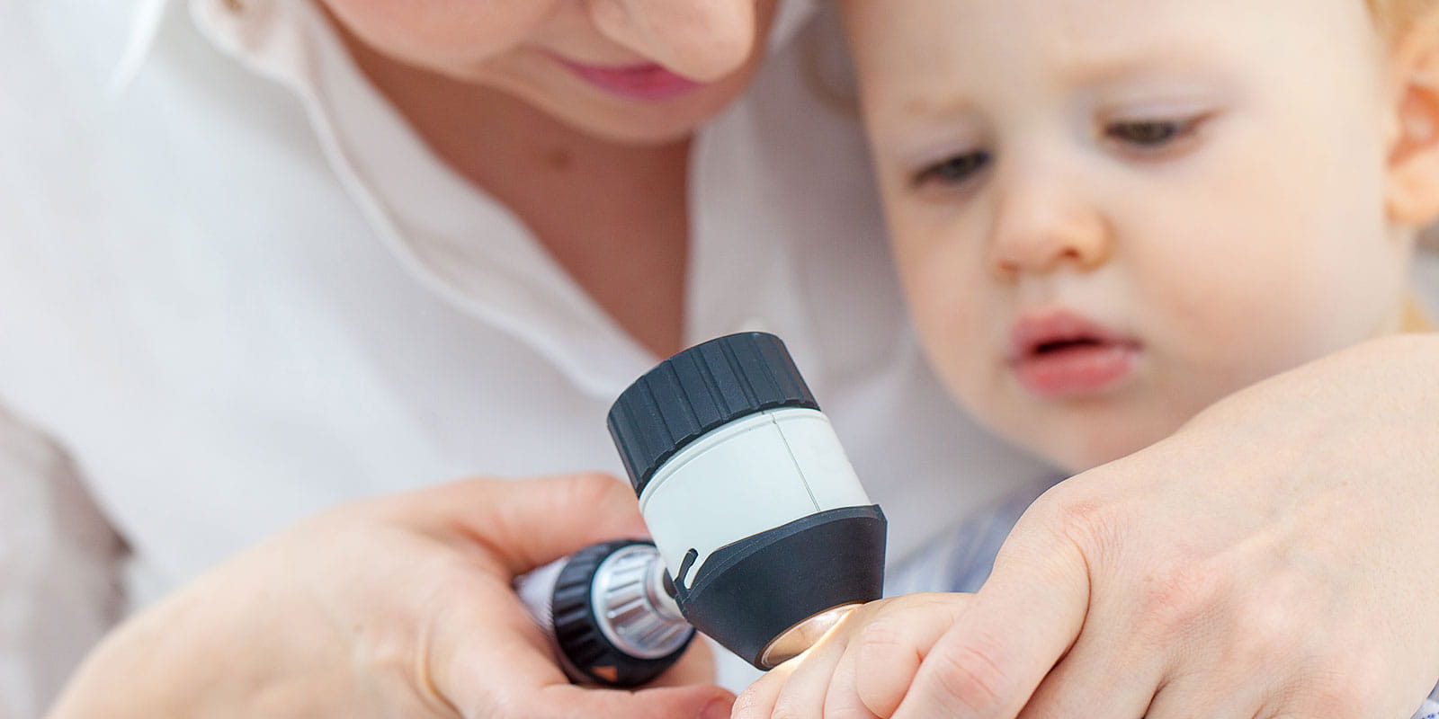 Baby boy has skin examined by Dermatologist