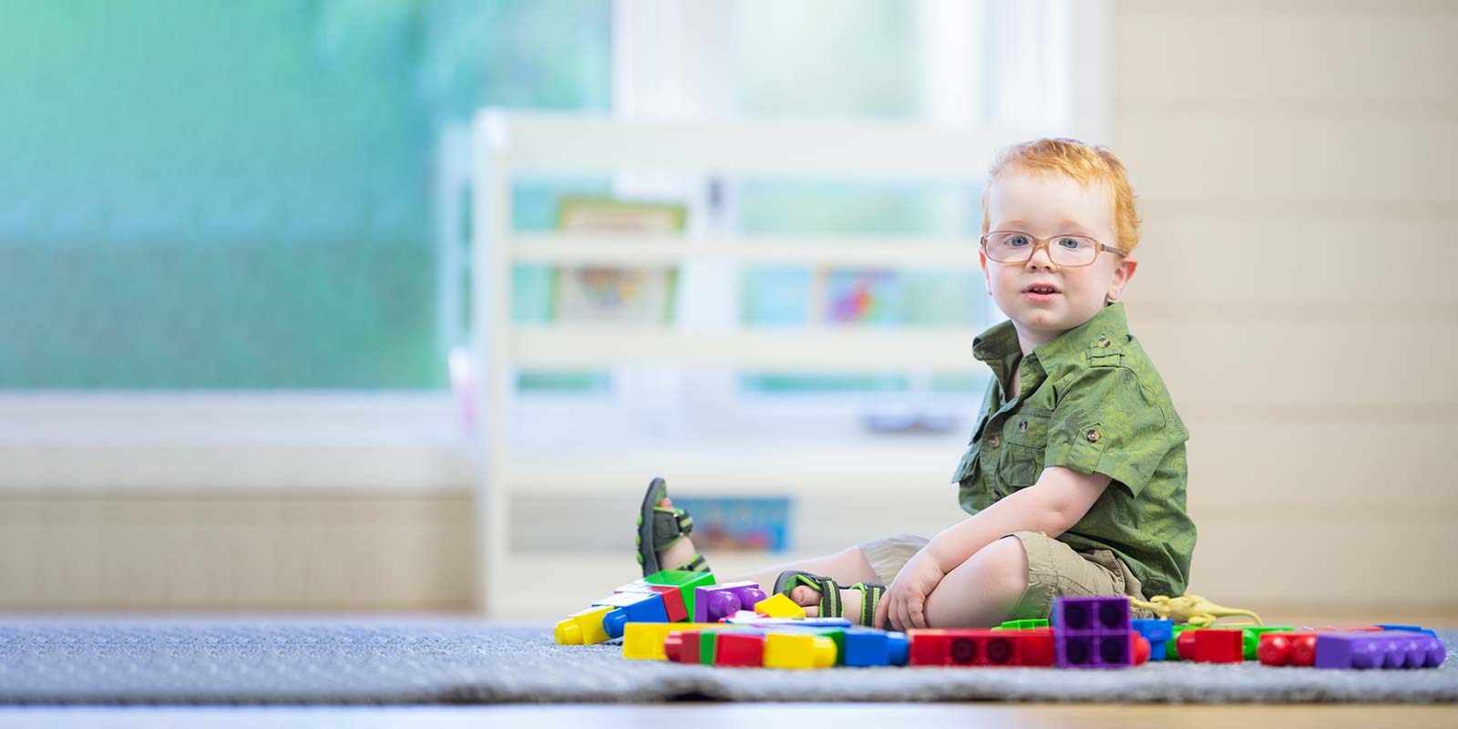 Happy toddler on the carpet