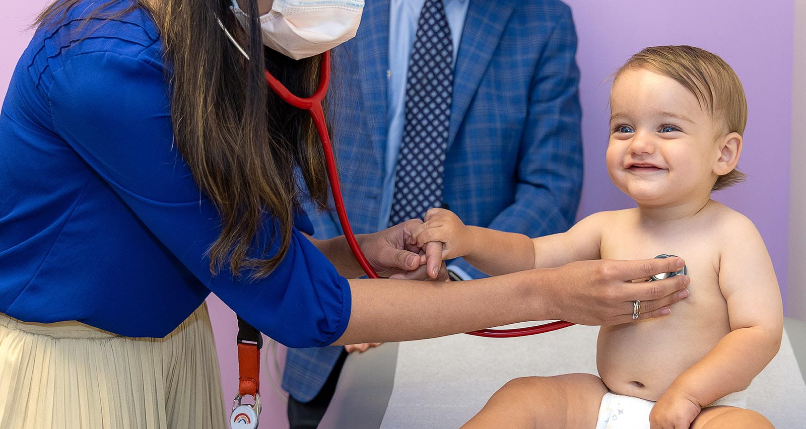 Erin Crawford, MD examines a young patient