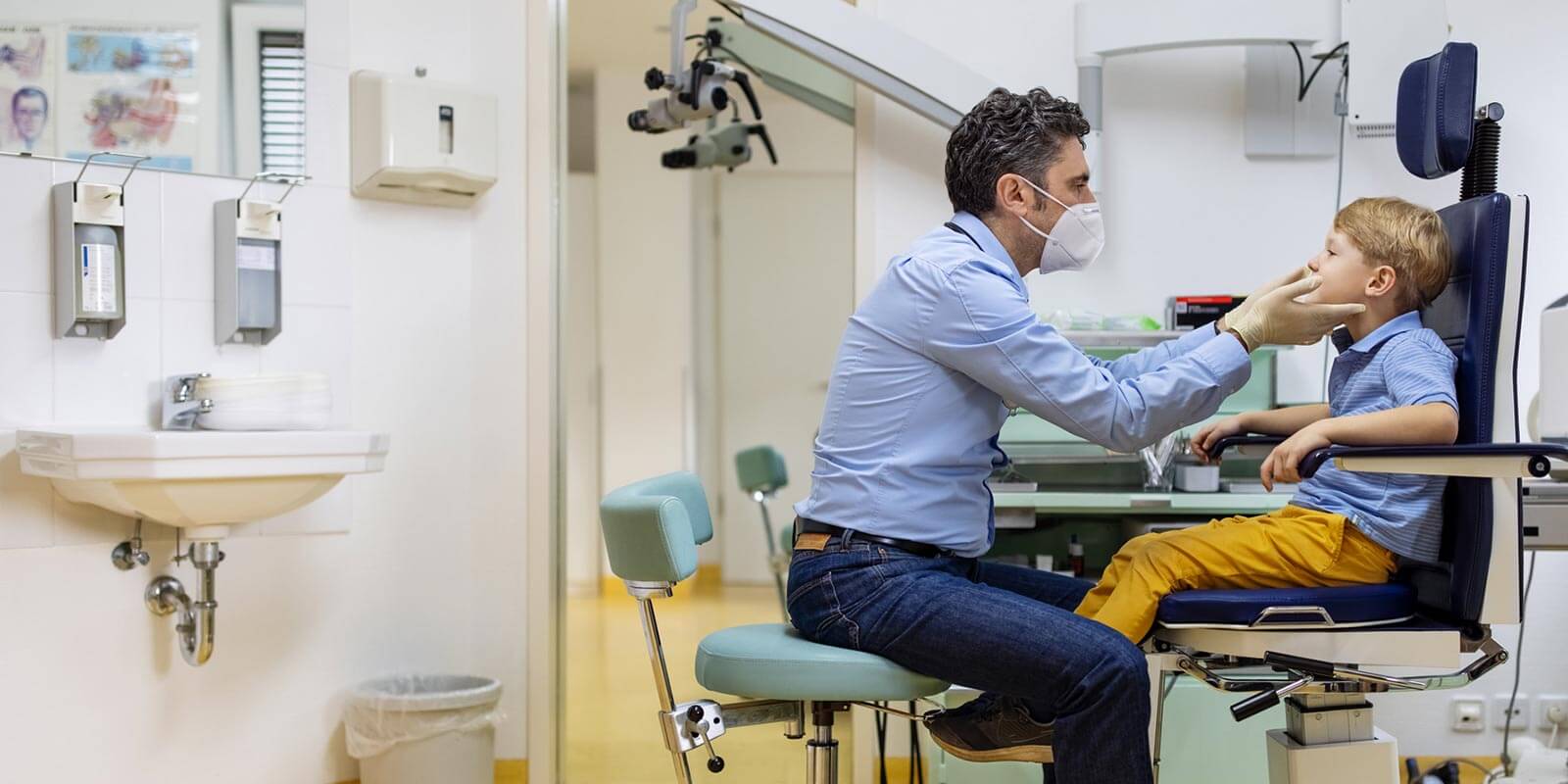 Doctor Examining Boys Throat