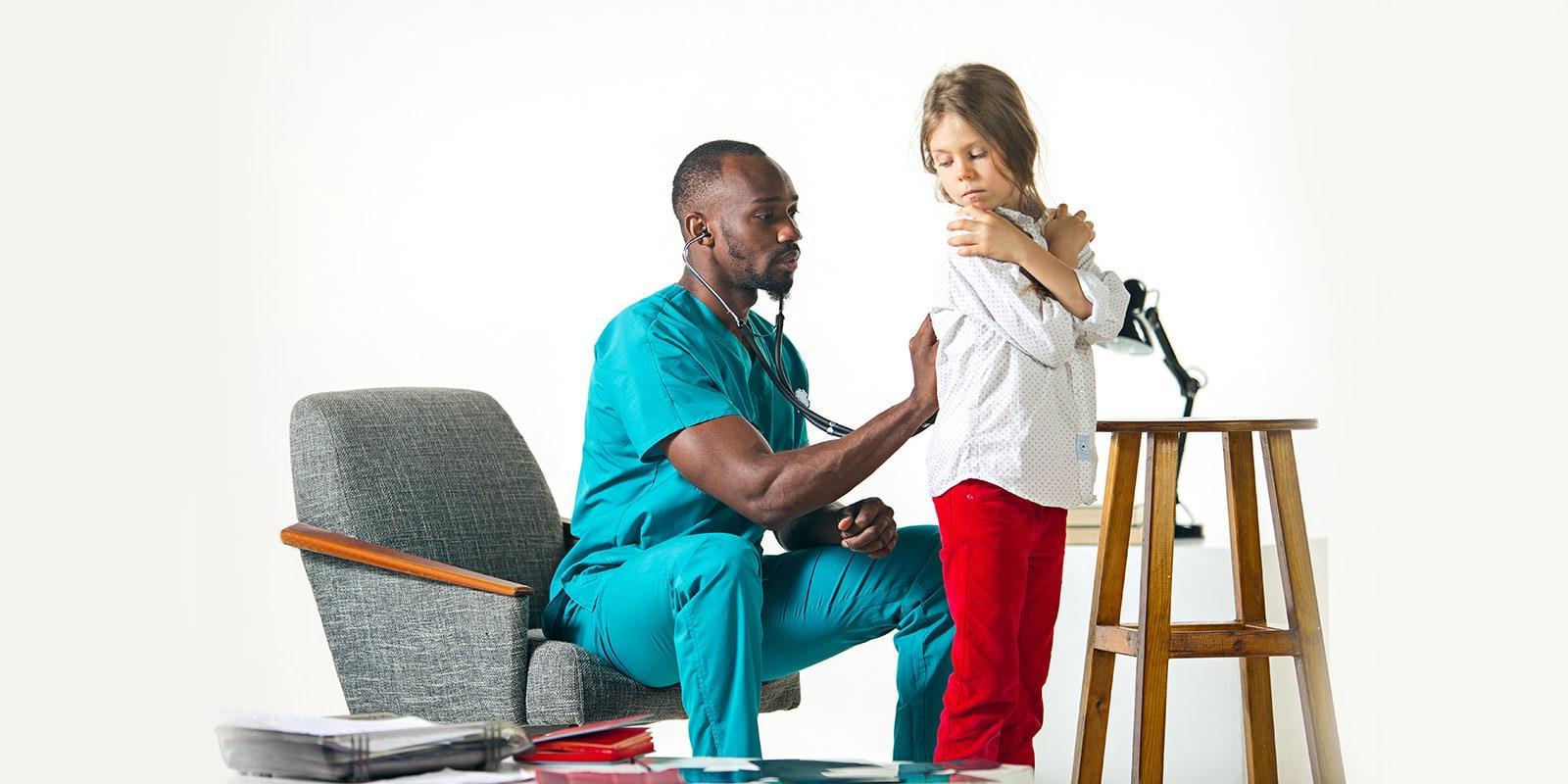 Doctor listening to child's lungs.