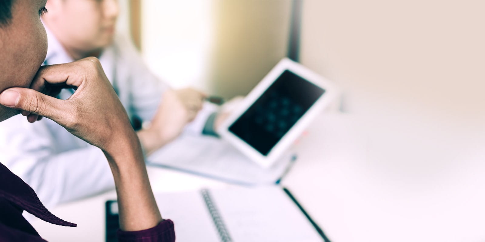 Mother reviews x-ray of child with doctor.