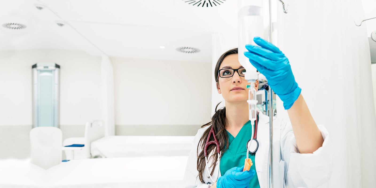 Anesthesiologist preparing medical supplies.