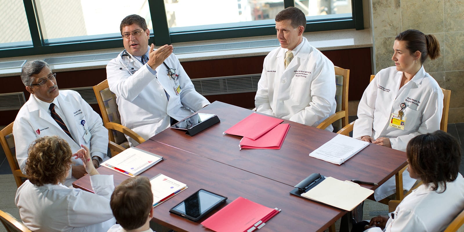 UH surgical oncology team talking about medical procedures.
