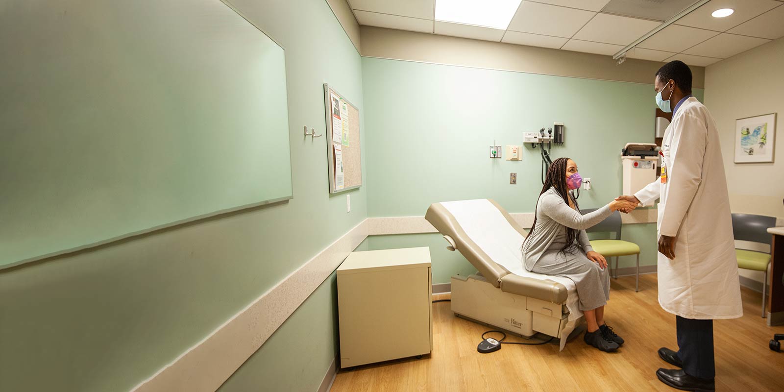 Dr. McClelland with patient to perform evaluation for radiation oncology