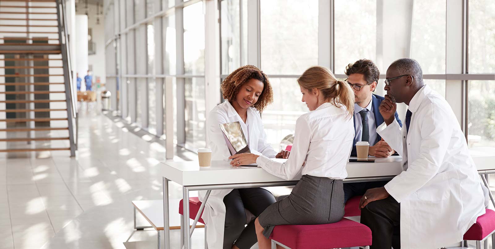 Multidisciplinary Group of Doctors Discussing Patient