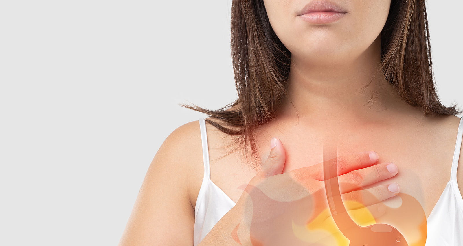 A woman suffering from an esophageal ulcer holding her upper chest