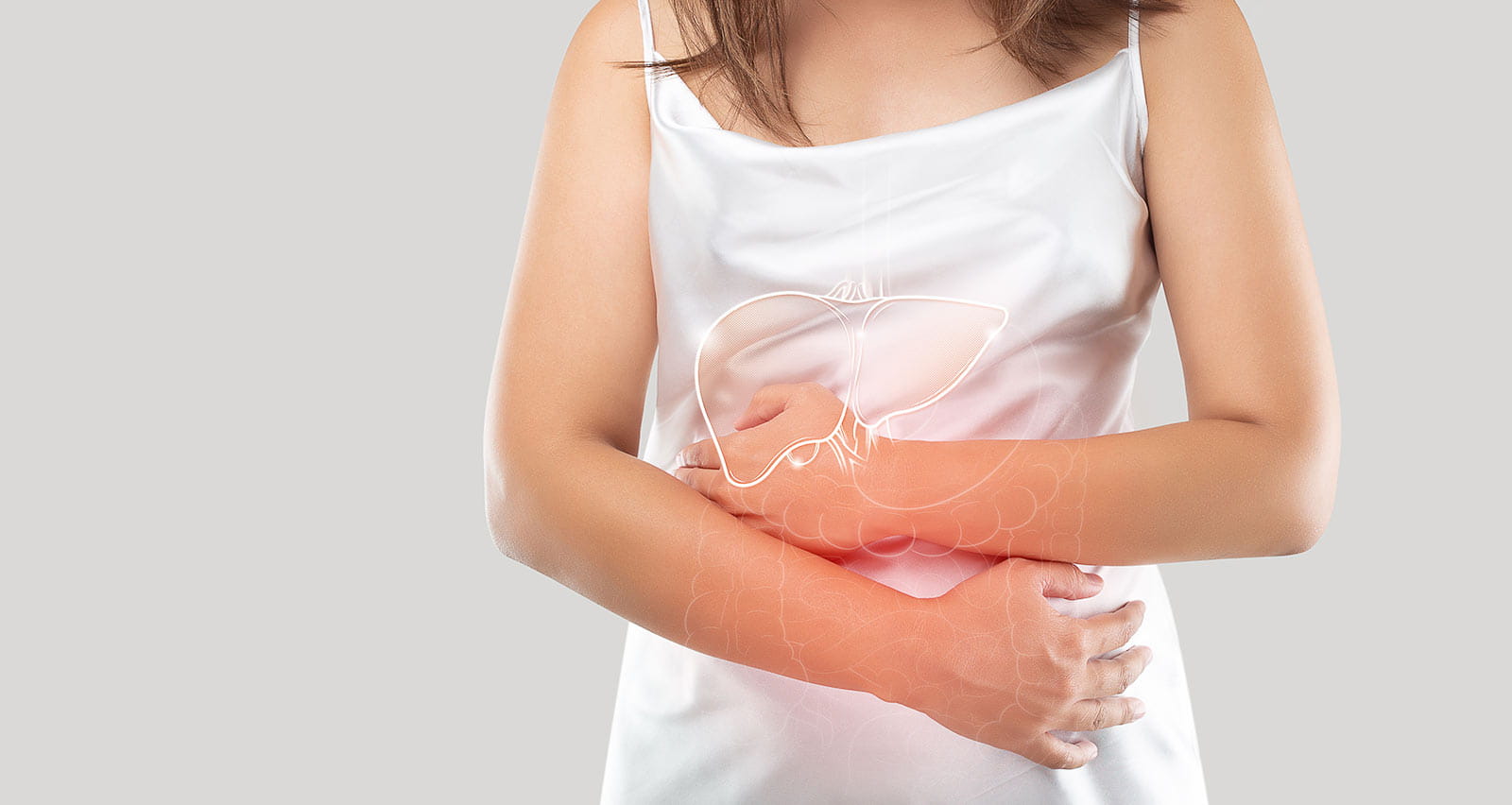 A woman clutching her liver area
