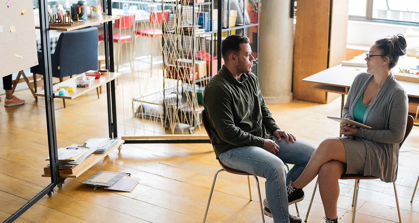 A psychologist in session with a transgender man