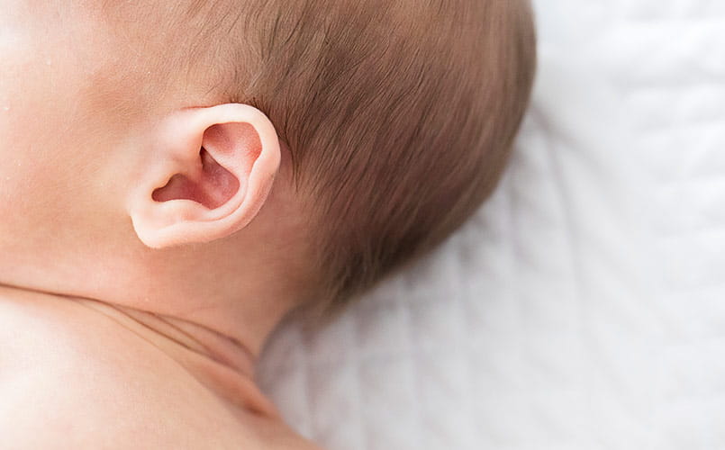 The ear and side profile of a newborn