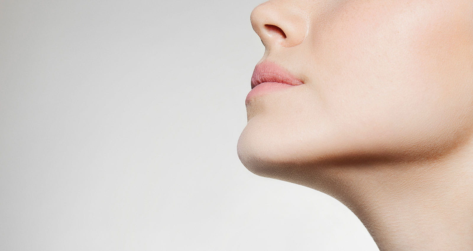 Low-angle shot of a woman’s jaw