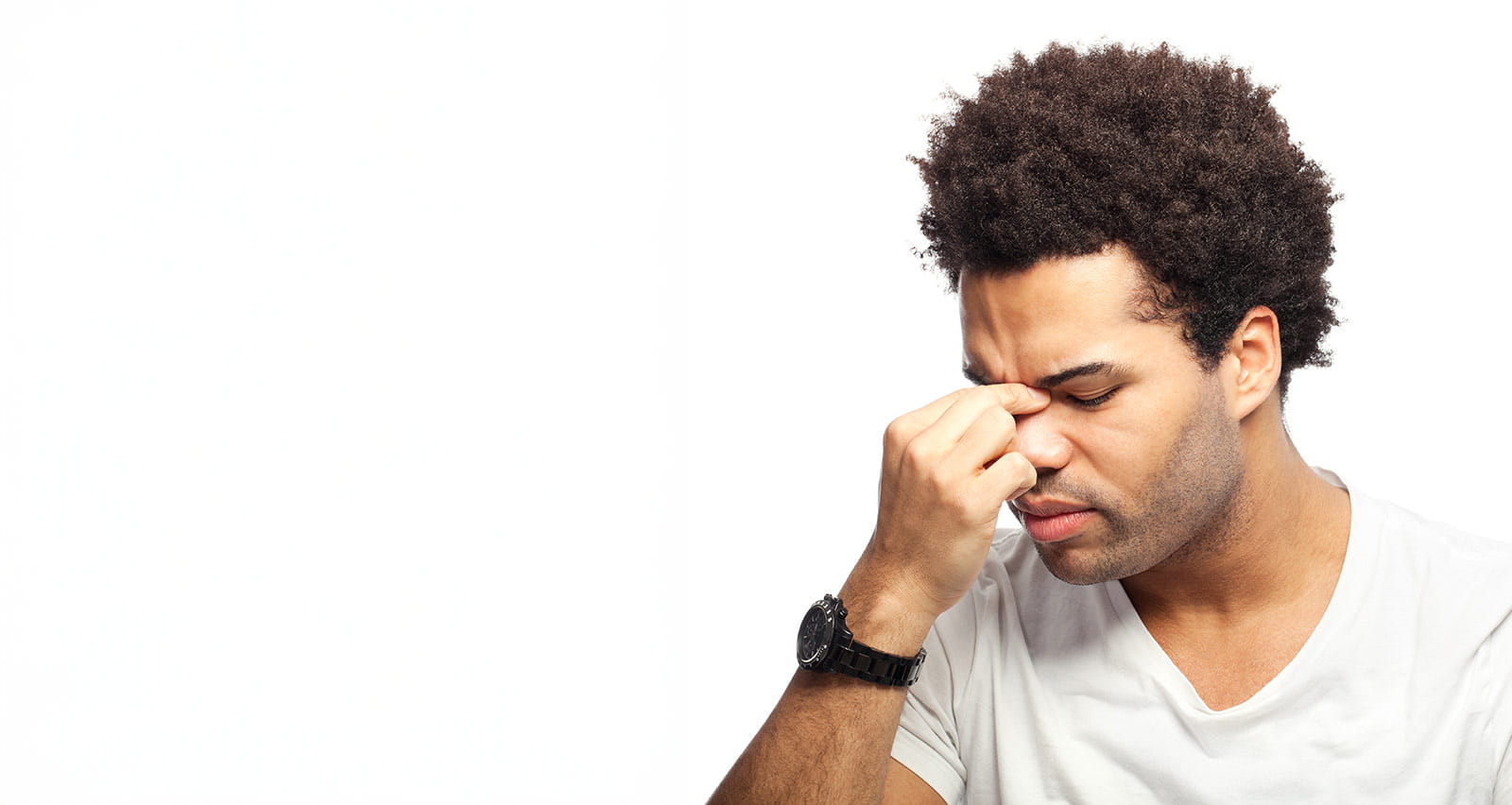 A young man suffering rhinitis