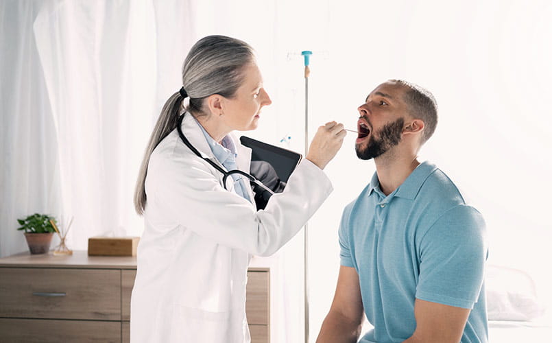 A provider uses a mouth swab on an employee as part of a screening