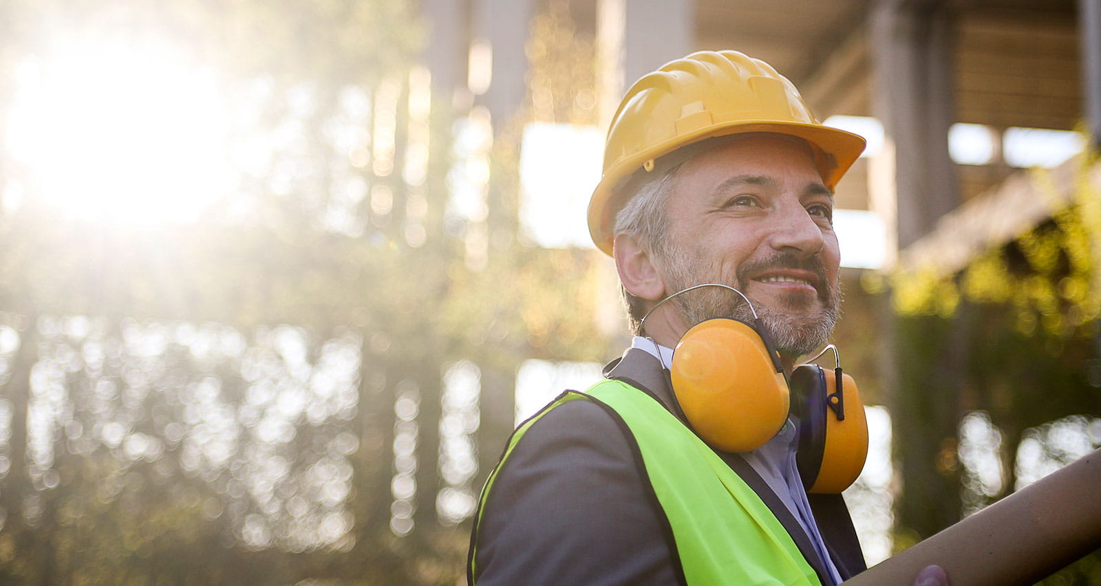 A middle-aged male engineer on a construction site