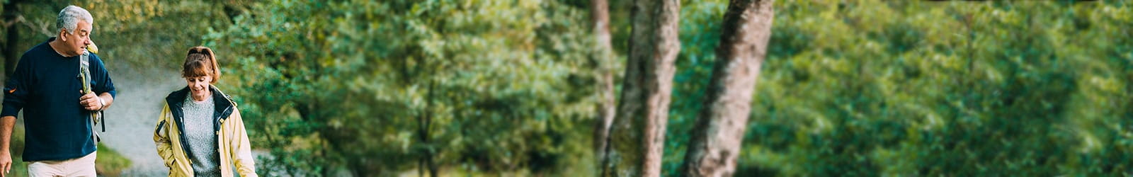 Senior couple hiking outdoors.