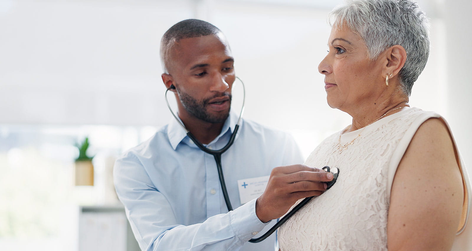 An older female patient is examined by her cardiologist