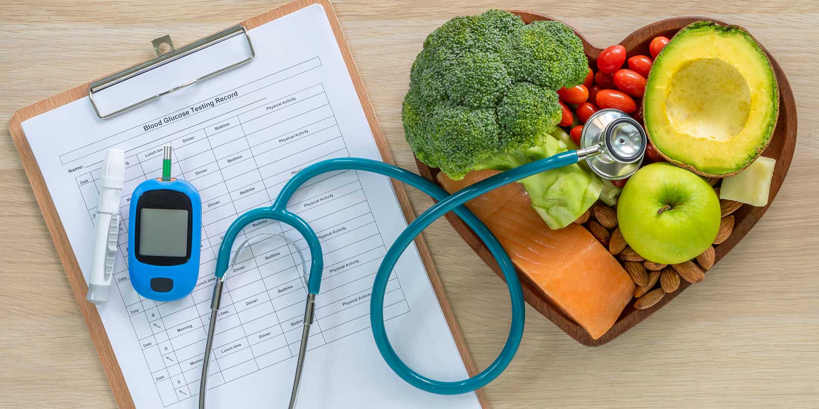 A heart-shaped tray filled with vegetables and fruits