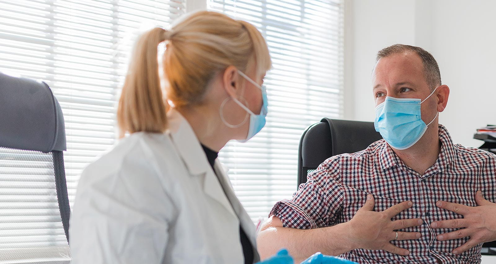 Cardiologist listening a patient concerned about chest pain