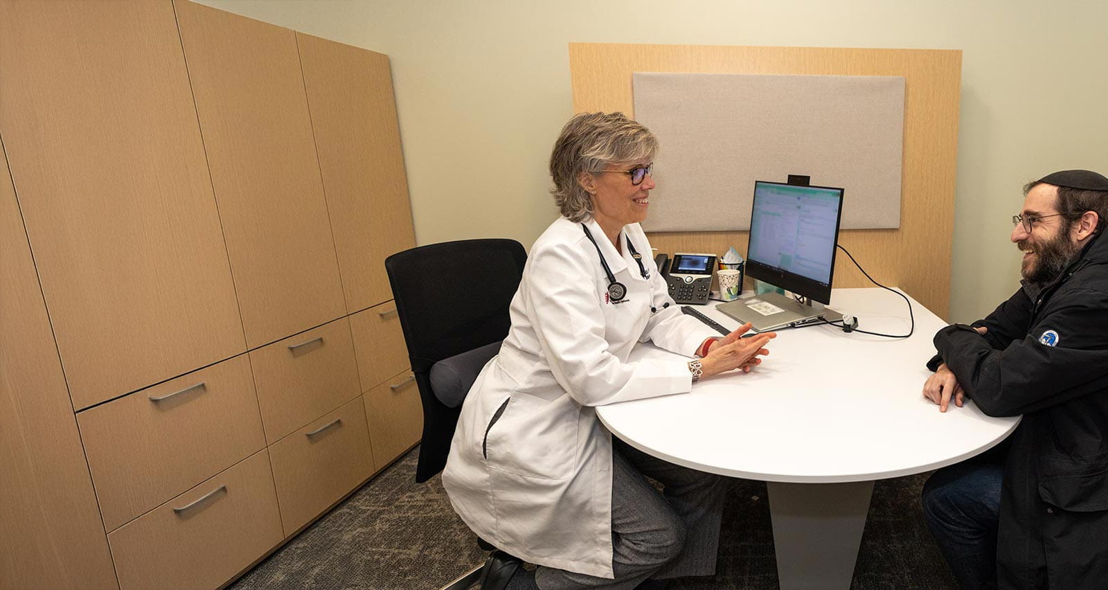 Dr. Kristin Kaebler consulting with patient at UH Connor Whole Health