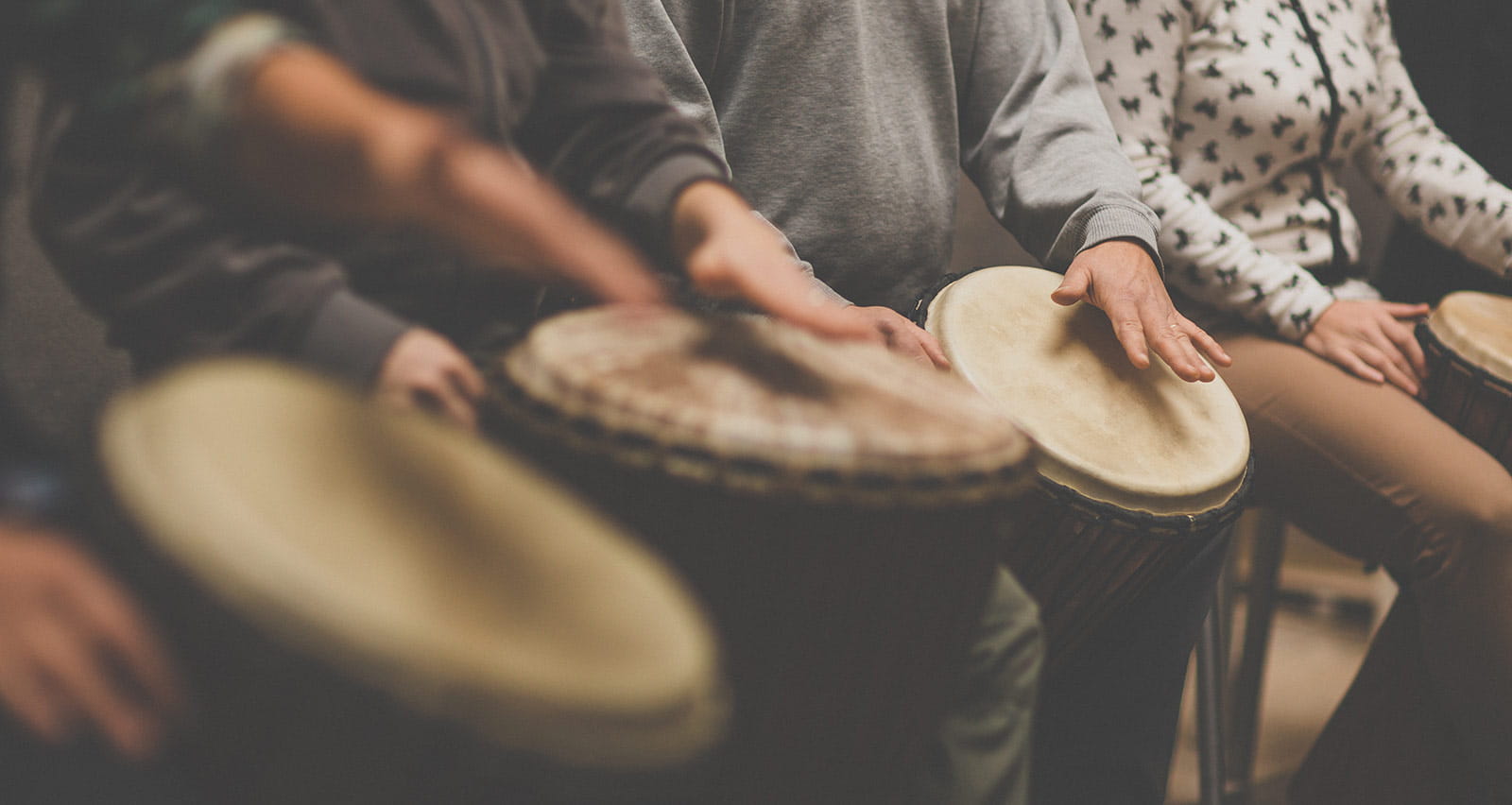 A therapy group plays drums