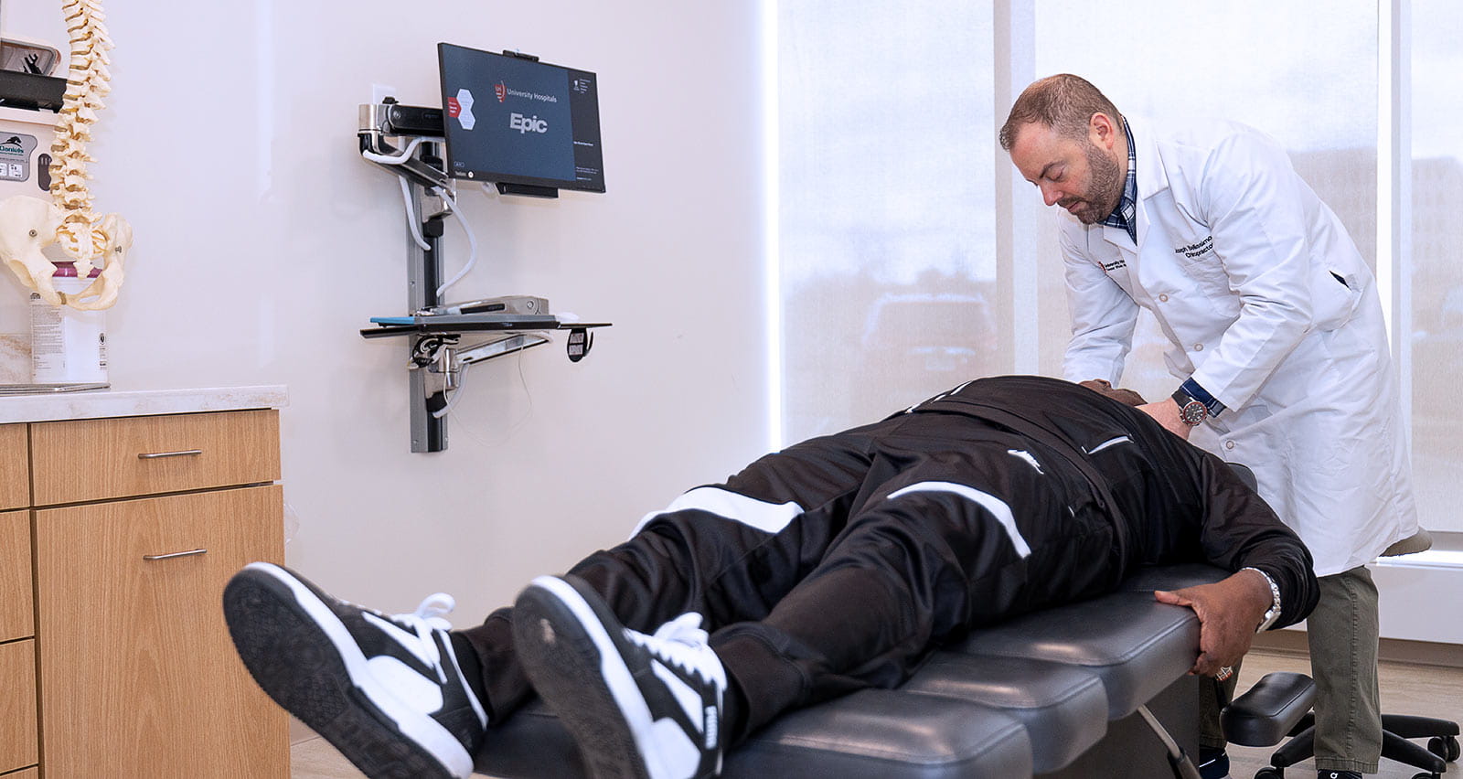 Joseph Bellissimo, DC treats a chiropractic patient at UH Connor Whole Health