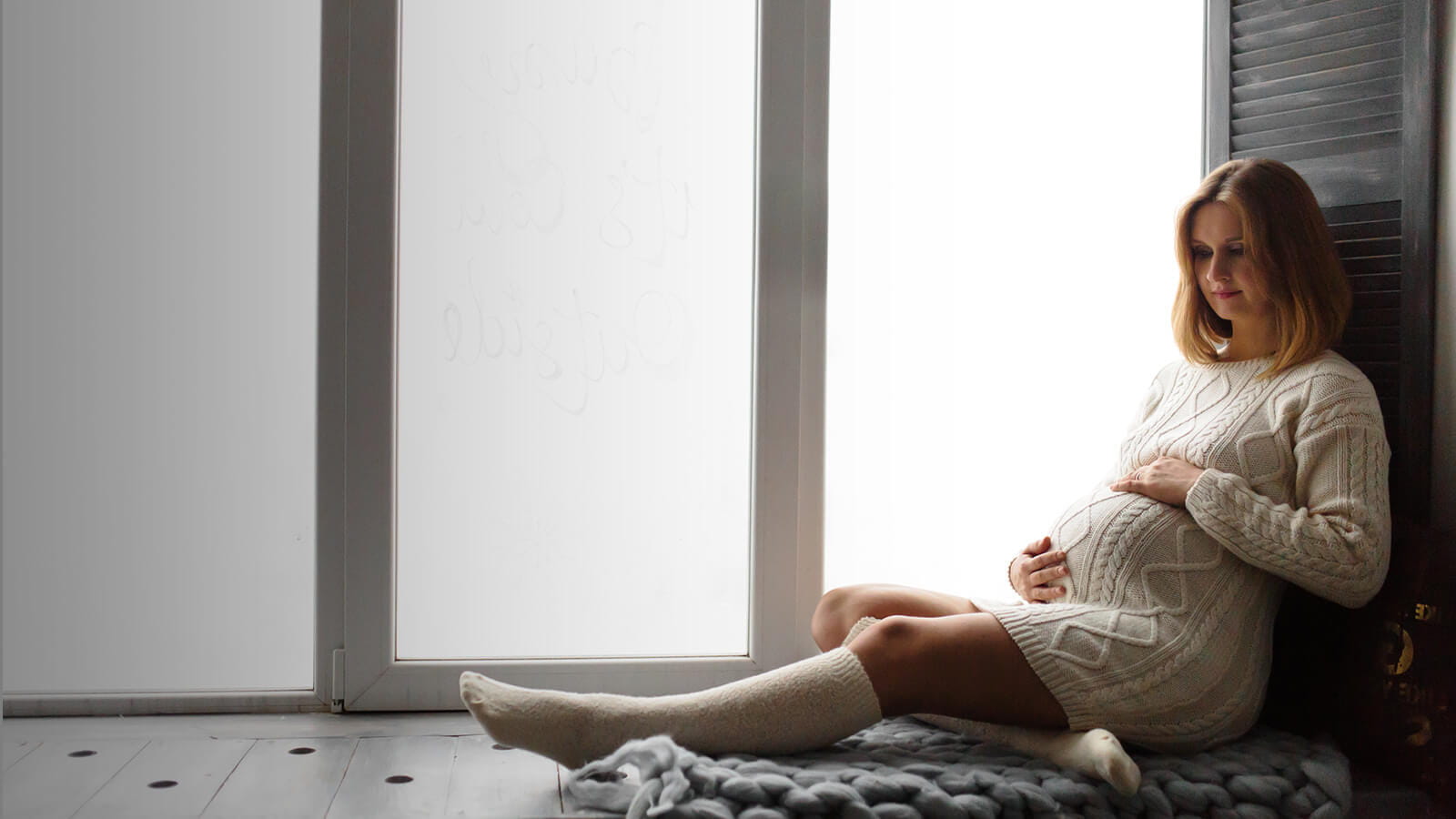 Expectant mother holding her stomach