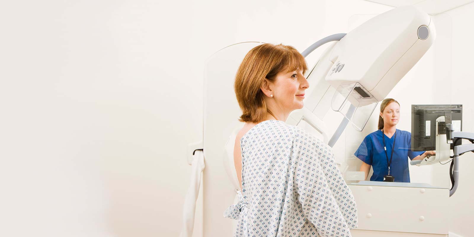 Women receiving mammogram