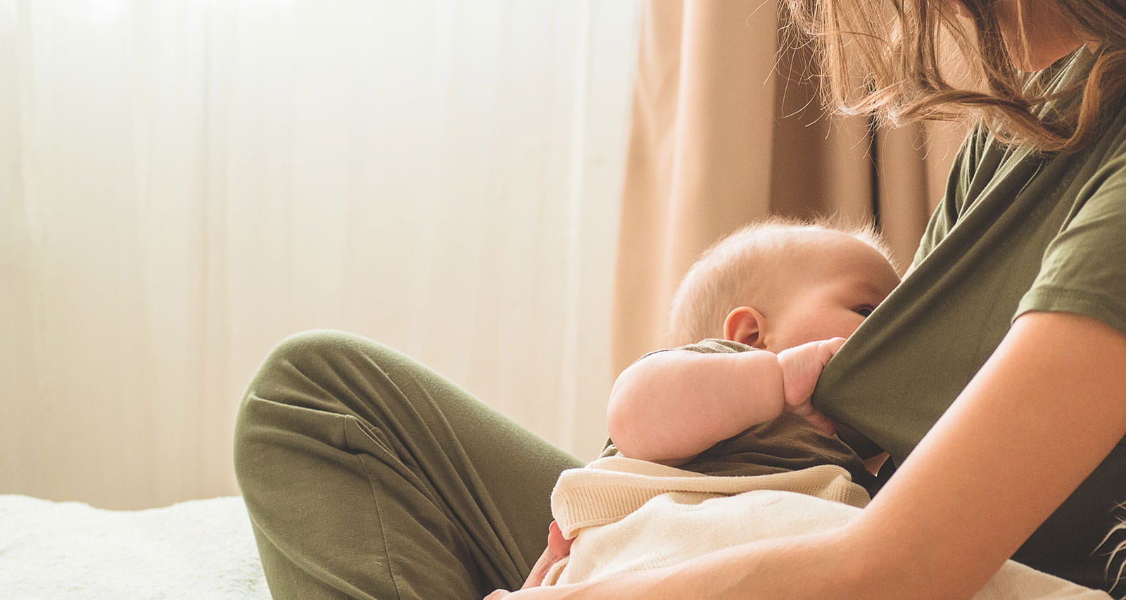 A mother breastfeeds her baby