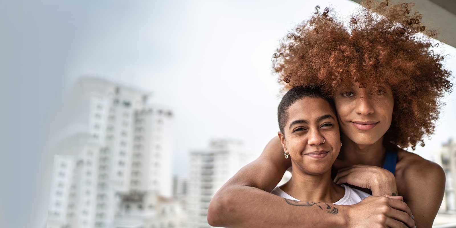 Portrait of a happy homosexual couple on a balcony