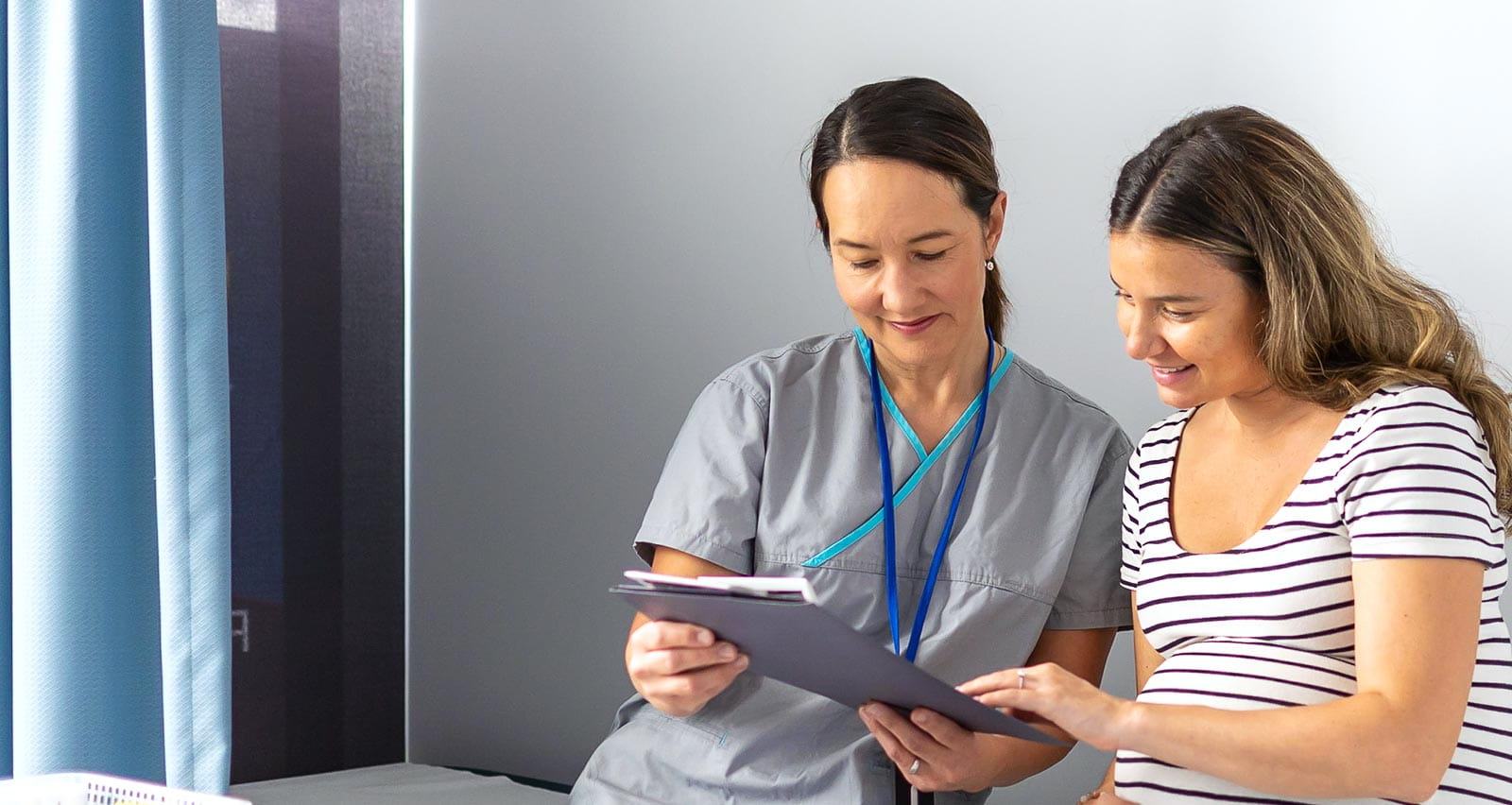 An expectant mother, surrounded by a calm medical clinic atmosphere, reviews her test findings with a compassionate nurse midwife