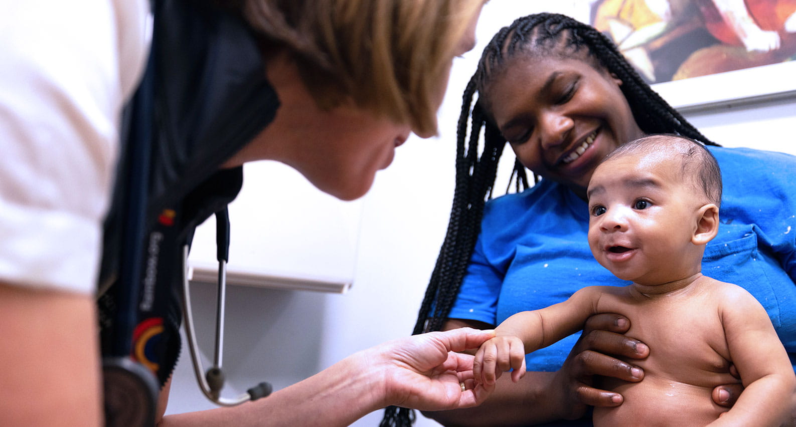 Eva Johnson, MD treats a mother and her baby at UH Rainbow Babies & Children’s Ahuja Center for Women & Children