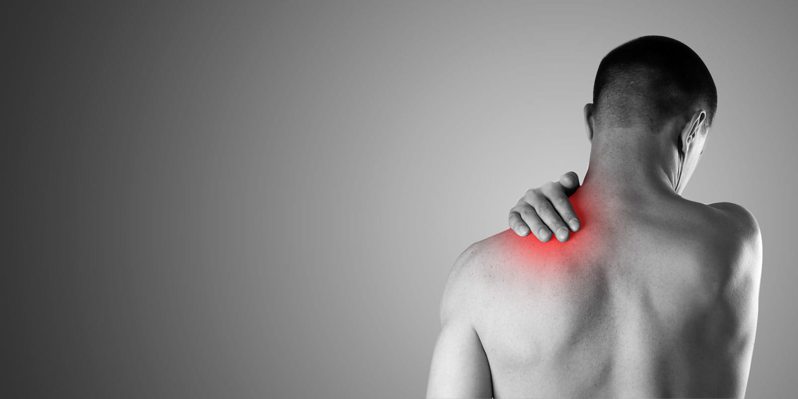 Man experiencing intense pain in his shoulder