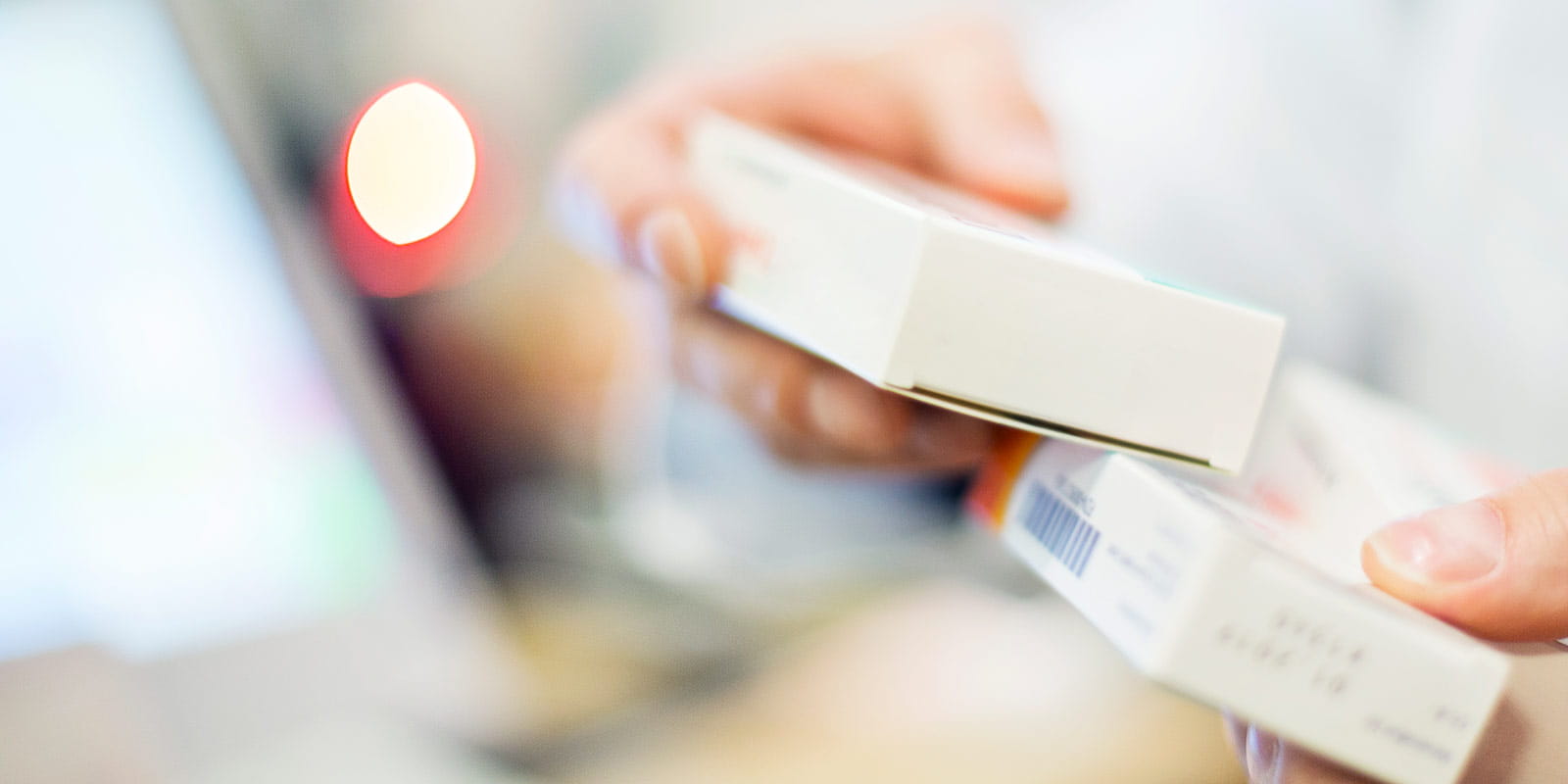 Pharmacist holding medicines